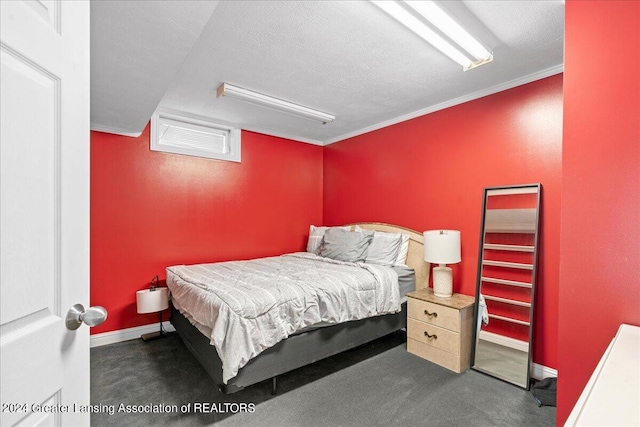 carpeted bedroom featuring a textured ceiling and ornamental molding