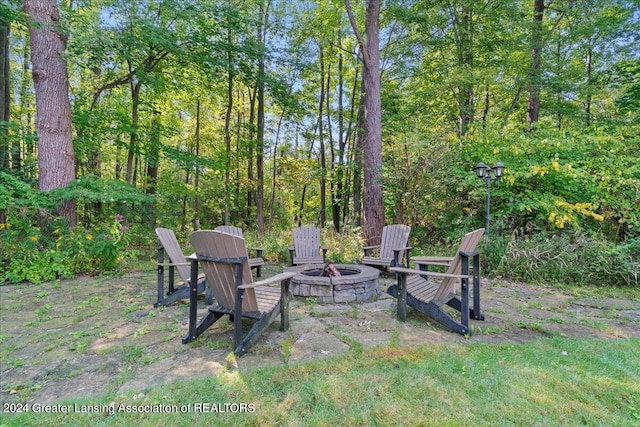 view of yard with an outdoor fire pit