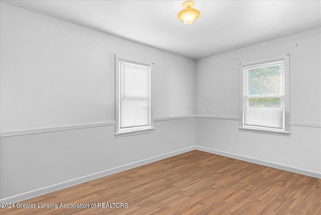 empty room with wood-type flooring