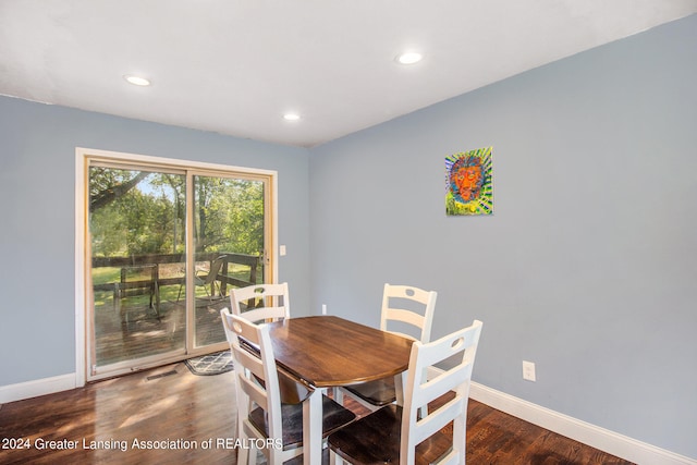 dining space featuring dark hardwood / wood-style flooring