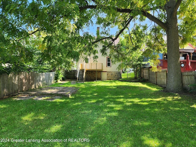 view of yard with a deck