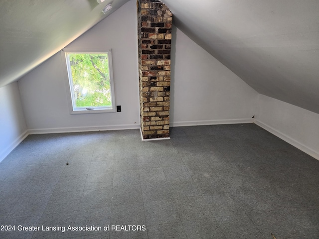 additional living space with vaulted ceiling