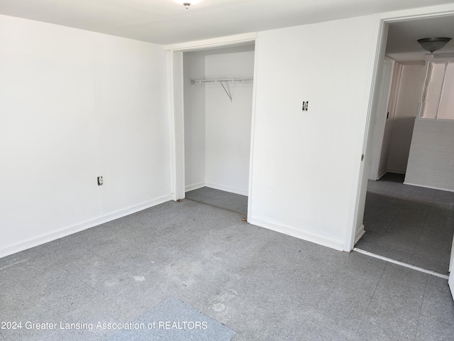 unfurnished bedroom with a closet