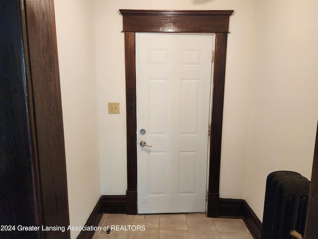 corridor featuring light tile patterned floors