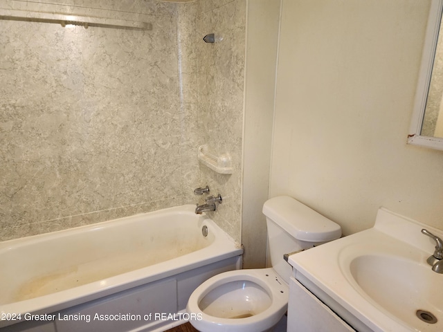 full bathroom with vanity, toilet, and tiled shower / bath