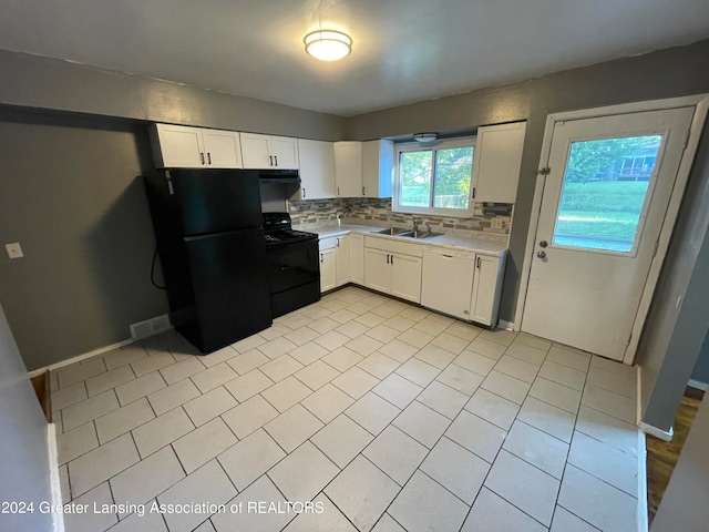 kitchen featuring black appliances, backsplash, white cabinetry, and sink