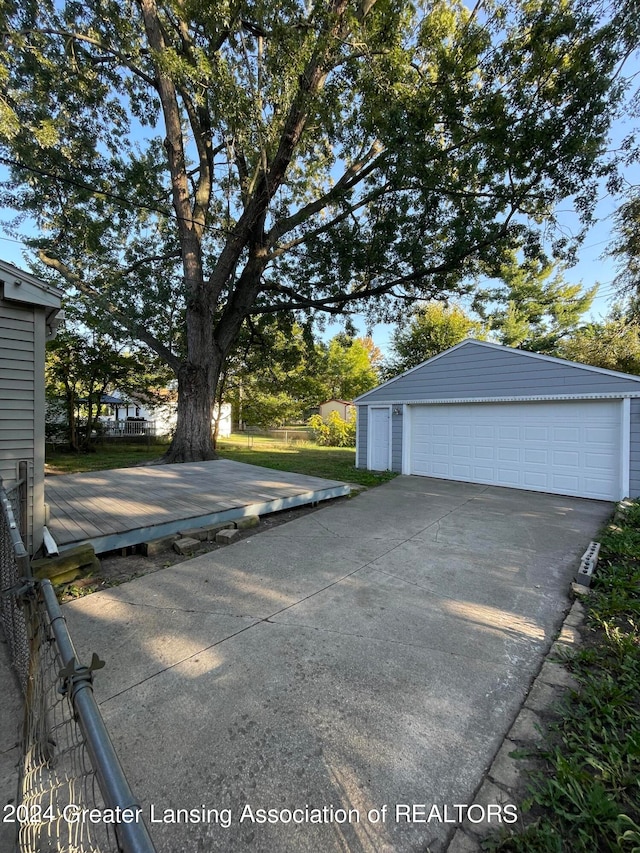 view of parking / parking lot with a garage