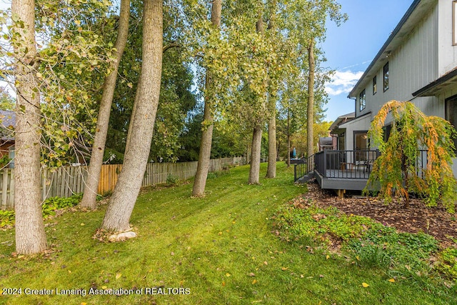 view of yard featuring a wooden deck