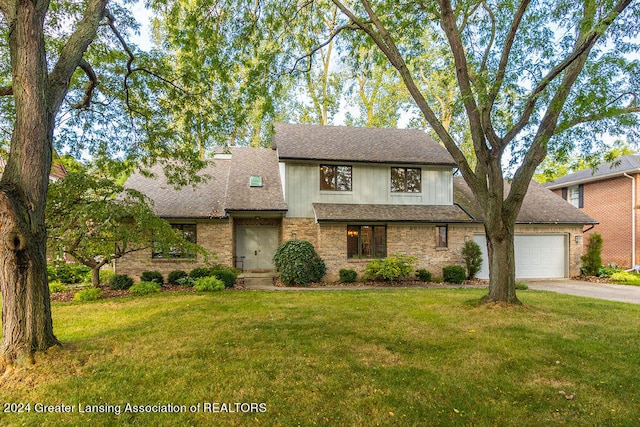 view of front of home featuring a garage and a front yard