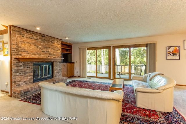 living room featuring a textured ceiling, carpet, and a brick fireplace