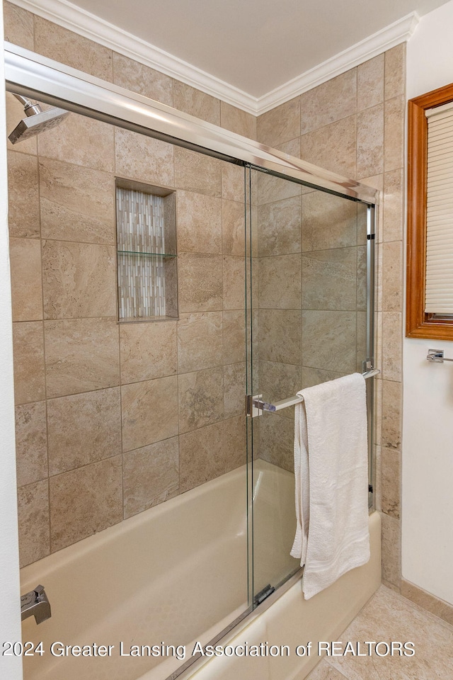 bathroom with bath / shower combo with glass door and crown molding