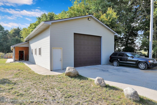 garage with a yard