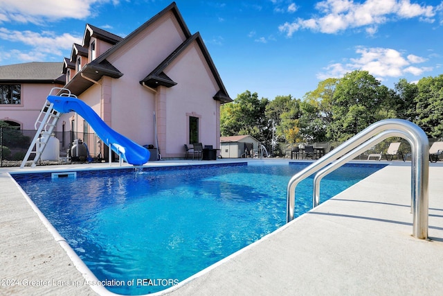 view of pool featuring a water slide