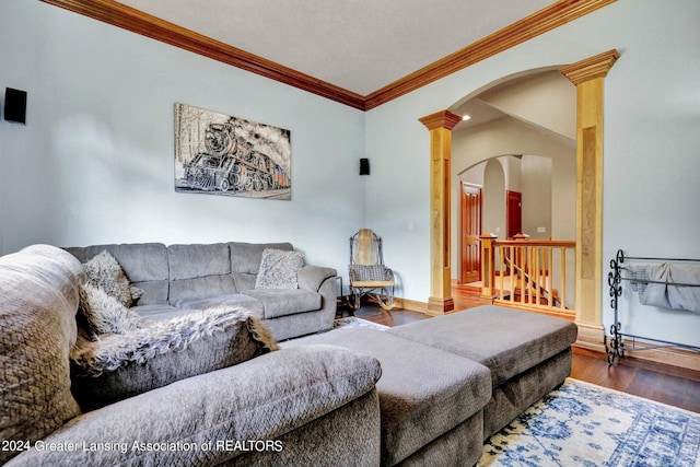 living room with ornamental molding, hardwood / wood-style floors, and ornate columns