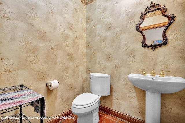 bathroom featuring tile patterned flooring and toilet