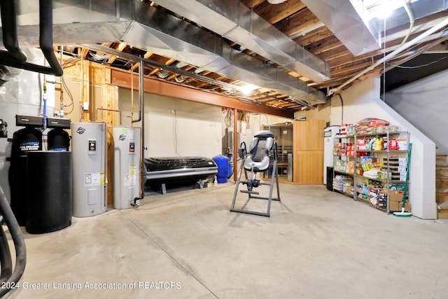 basement with water heater and electric water heater