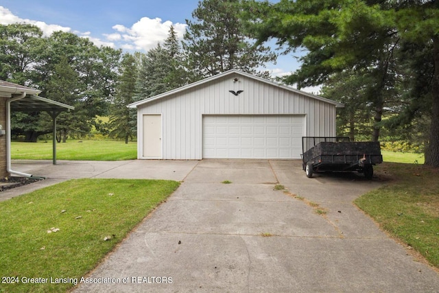 garage featuring a lawn