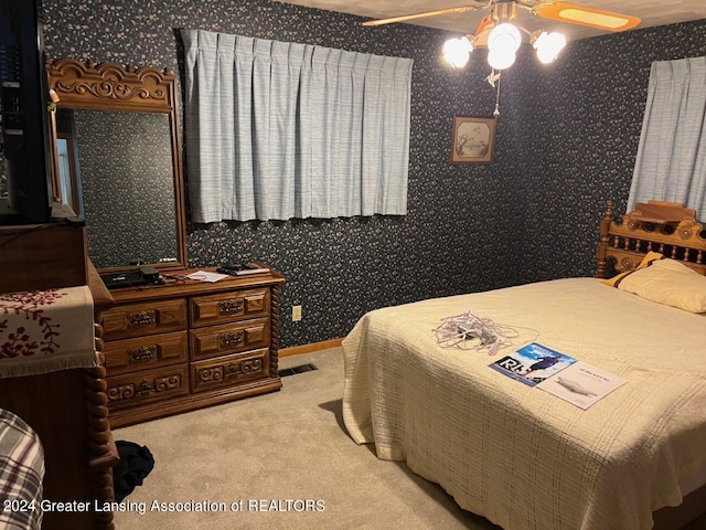 carpeted bedroom featuring ceiling fan