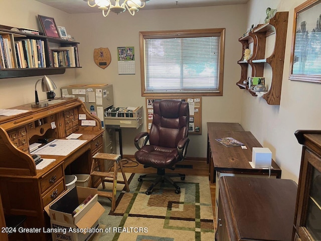 office featuring an inviting chandelier and hardwood / wood-style floors