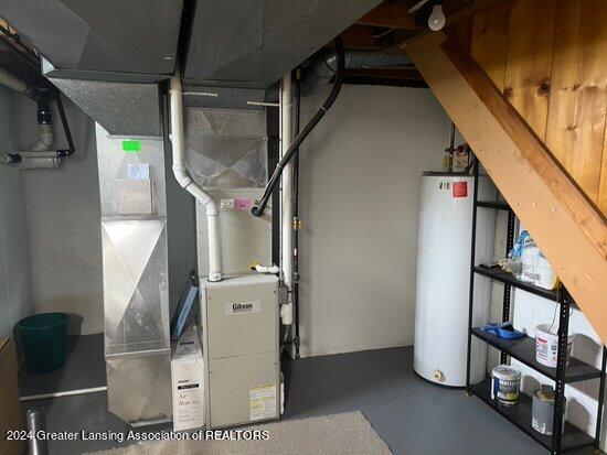 utility room with water heater