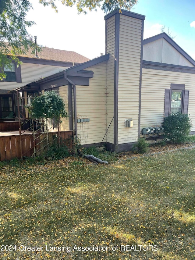 view of property exterior featuring a yard