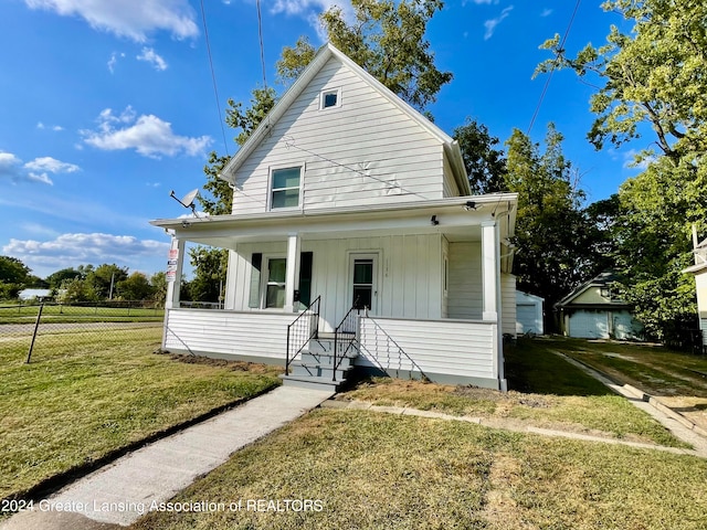 view of front of home featuring a front yard and covered porch