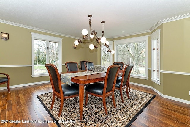 dining area with an inviting chandelier, crown molding, and dark hardwood / wood-style floors