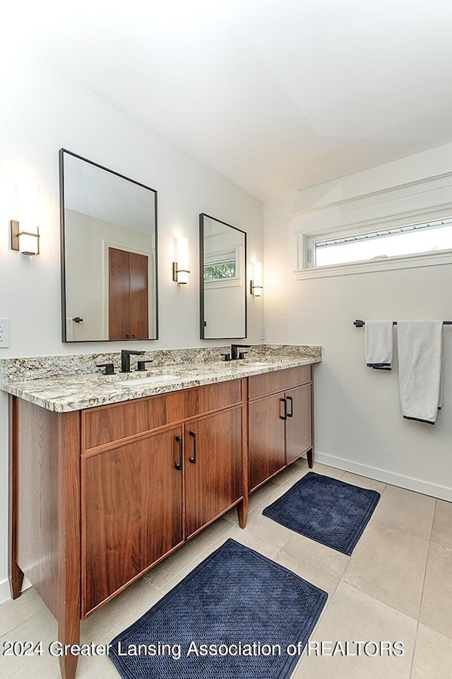 bathroom with vanity and tile patterned floors