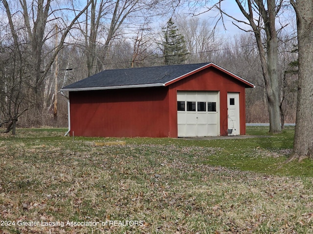 garage featuring a yard