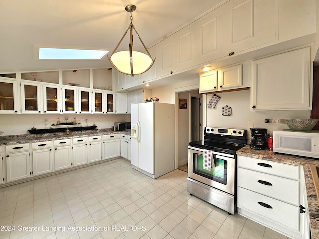 kitchen with white cabinets, hanging light fixtures, lofted ceiling with skylight, and white appliances