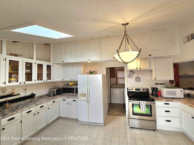 kitchen with washer / clothes dryer, white cabinets, white appliances, pendant lighting, and a skylight