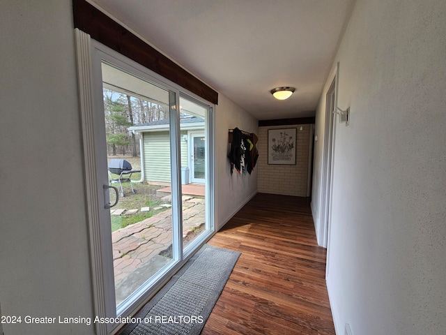 hall with wood-type flooring