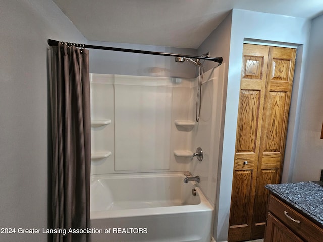 bathroom featuring vanity and shower / bath combination with curtain