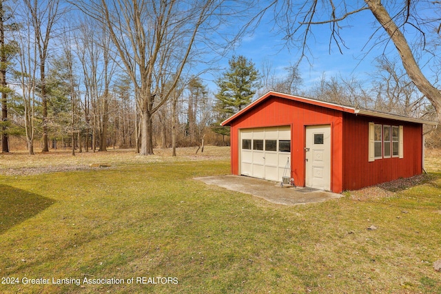 garage featuring a yard