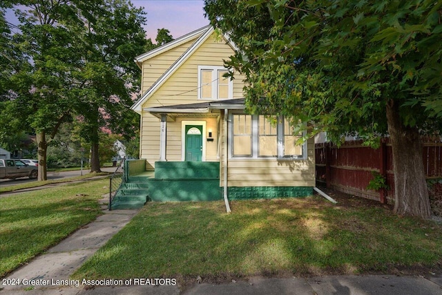 view of front of house with a yard