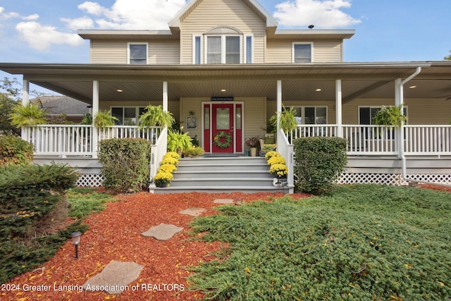 country-style home featuring a porch