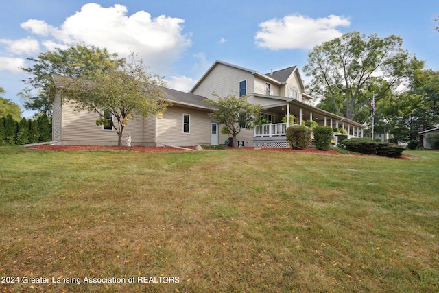 exterior space with a lawn and covered porch