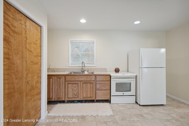 kitchen with white appliances and sink