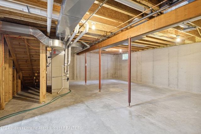 basement featuring heating unit