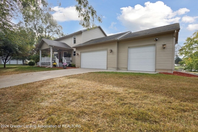 view of front facade with a front yard and a garage