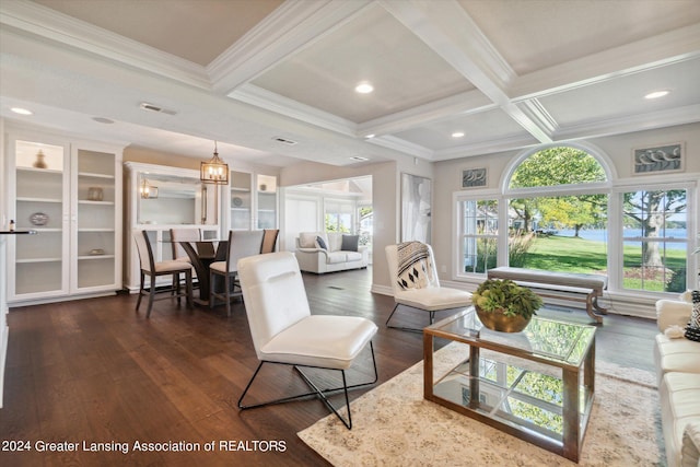 living room with coffered ceiling, dark hardwood / wood-style flooring, beamed ceiling, crown molding, and a chandelier