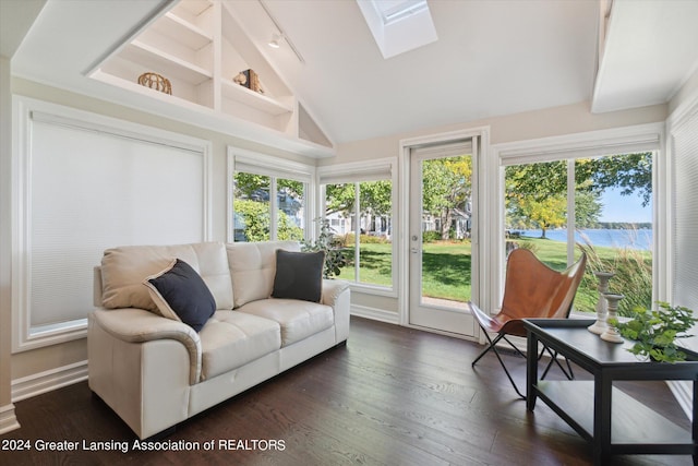 sunroom / solarium with lofted ceiling with skylight