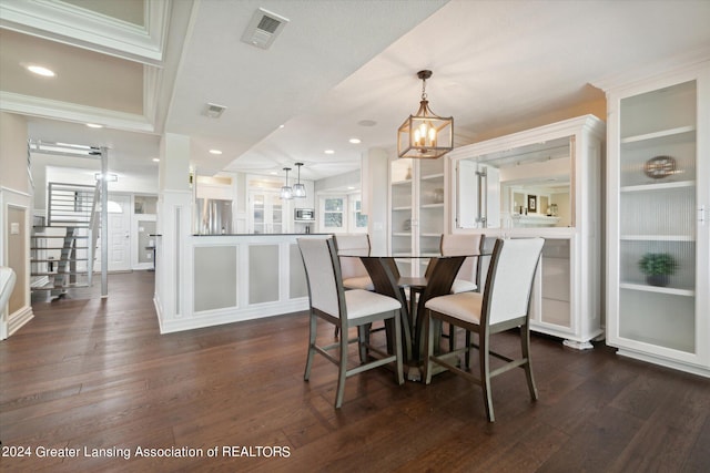 dining room featuring a chandelier and dark hardwood / wood-style flooring