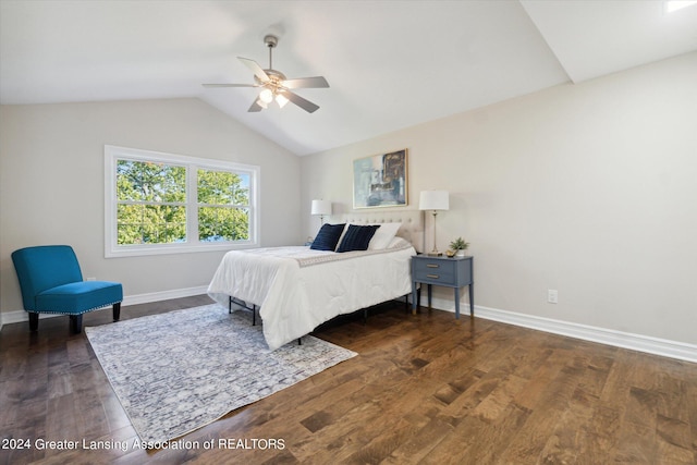 bedroom with vaulted ceiling, dark hardwood / wood-style floors, and ceiling fan