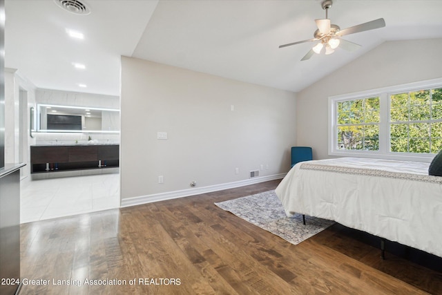 bedroom with wood-type flooring, vaulted ceiling, and ceiling fan