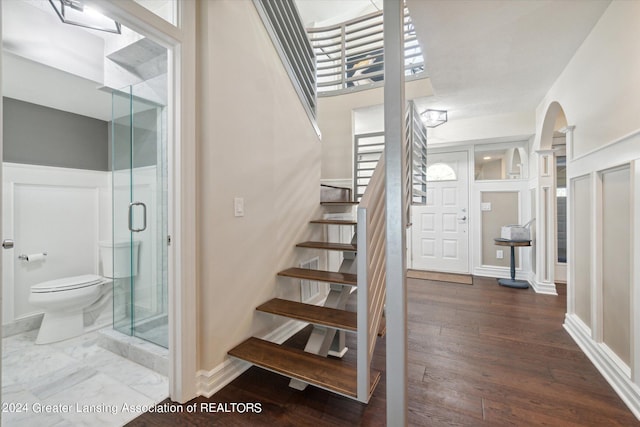 stairway with wood-type flooring