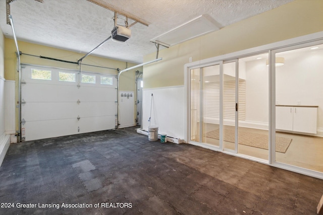 garage with a garage door opener and wooden walls