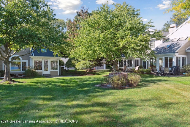 view of yard with french doors