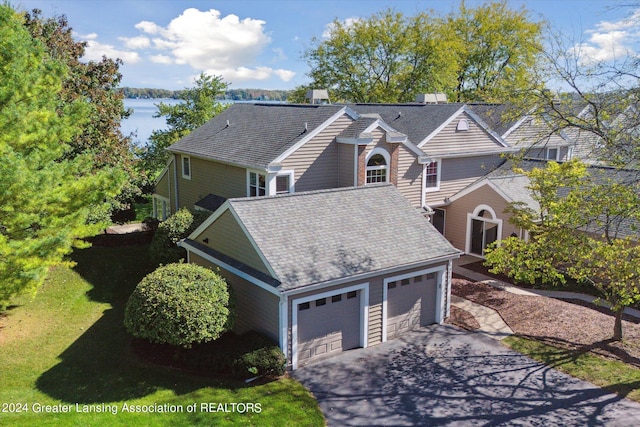 view of front property with a front yard and a garage