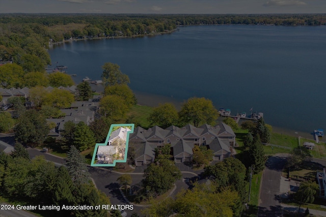 birds eye view of property with a water view